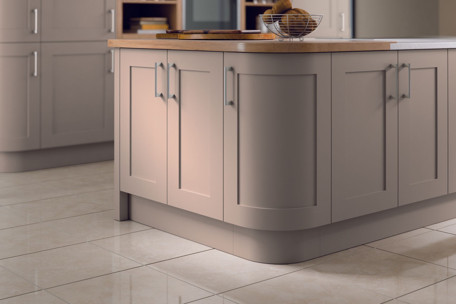 Gray kitchen island cabinets with a wooden countertop and curved corner unit on a light tiled floor.