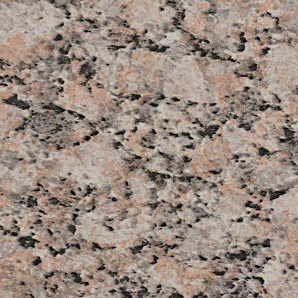 Close-up view of beige, grey, and black granite stone with a speckled, textured pattern.