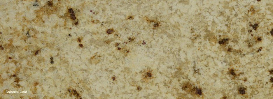 Close-up view of granite stone slab with beige, cream, and brown speckled patterns.
