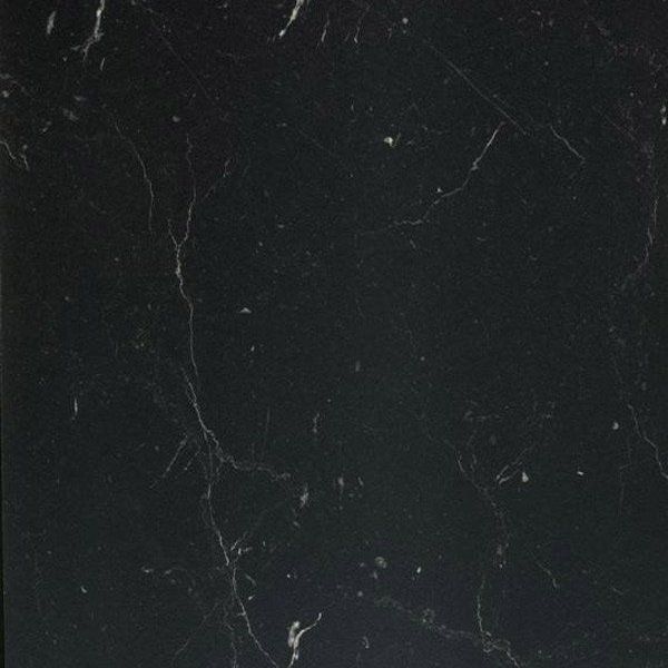 Black marble texture with thin, delicate white veins running across the dark surface.