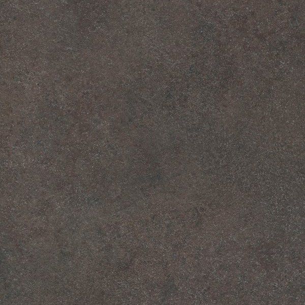 A close-up, textured surface of dark gray or charcoal-colored stone or concrete with subtle, mottled variations.