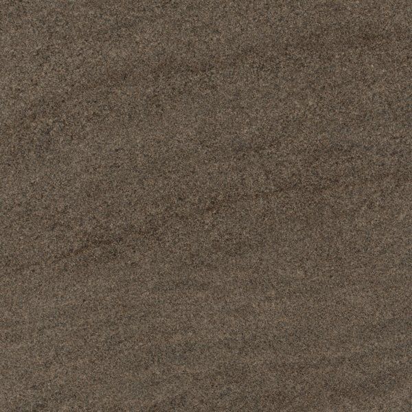 A close-up of a textured surface with shades of dark brown and gray, resembling natural stone or slate.
