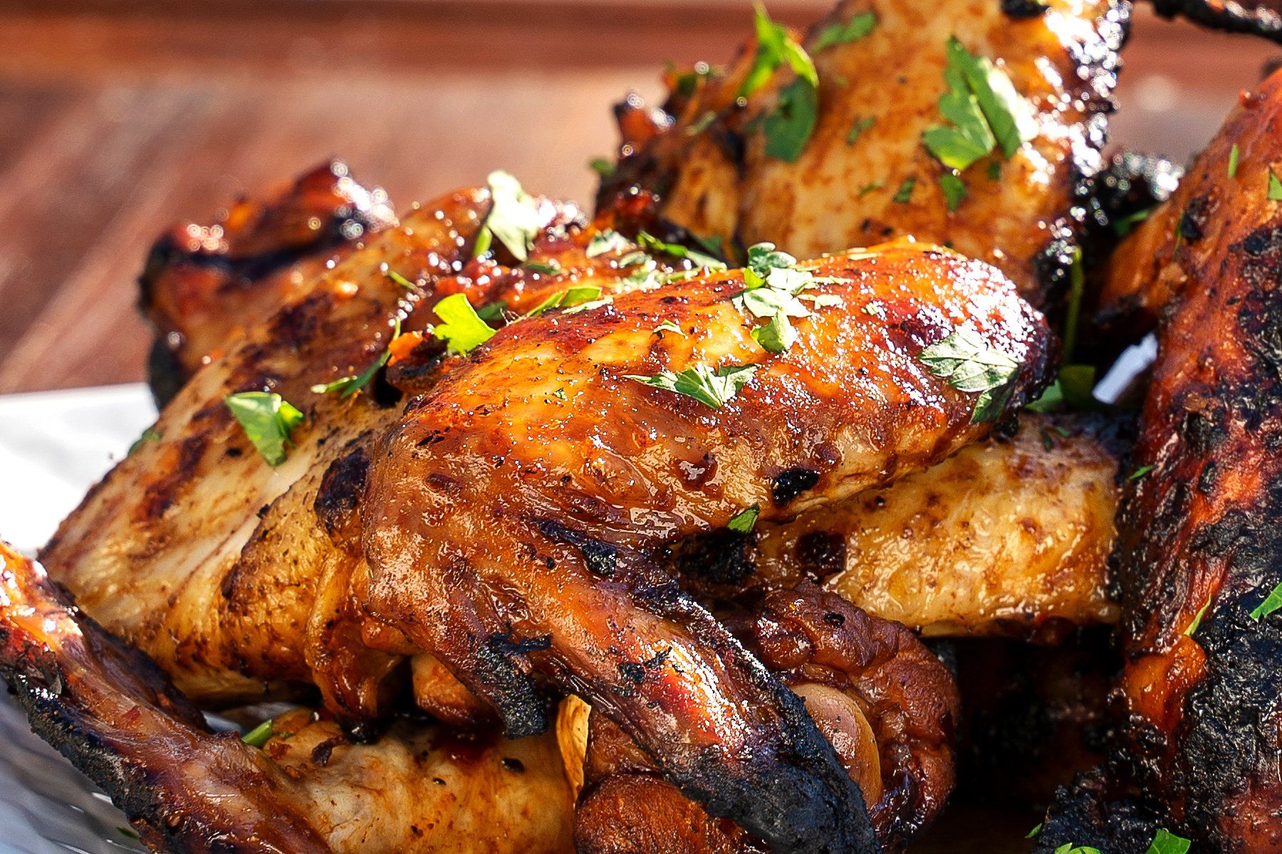 Closeup photo of fiery hot wings on a plate