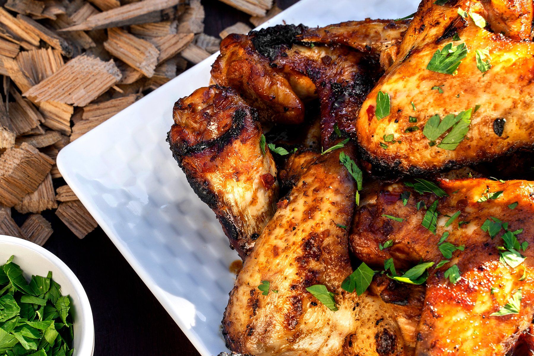 Closeup photo of fiery hot wings on a plate