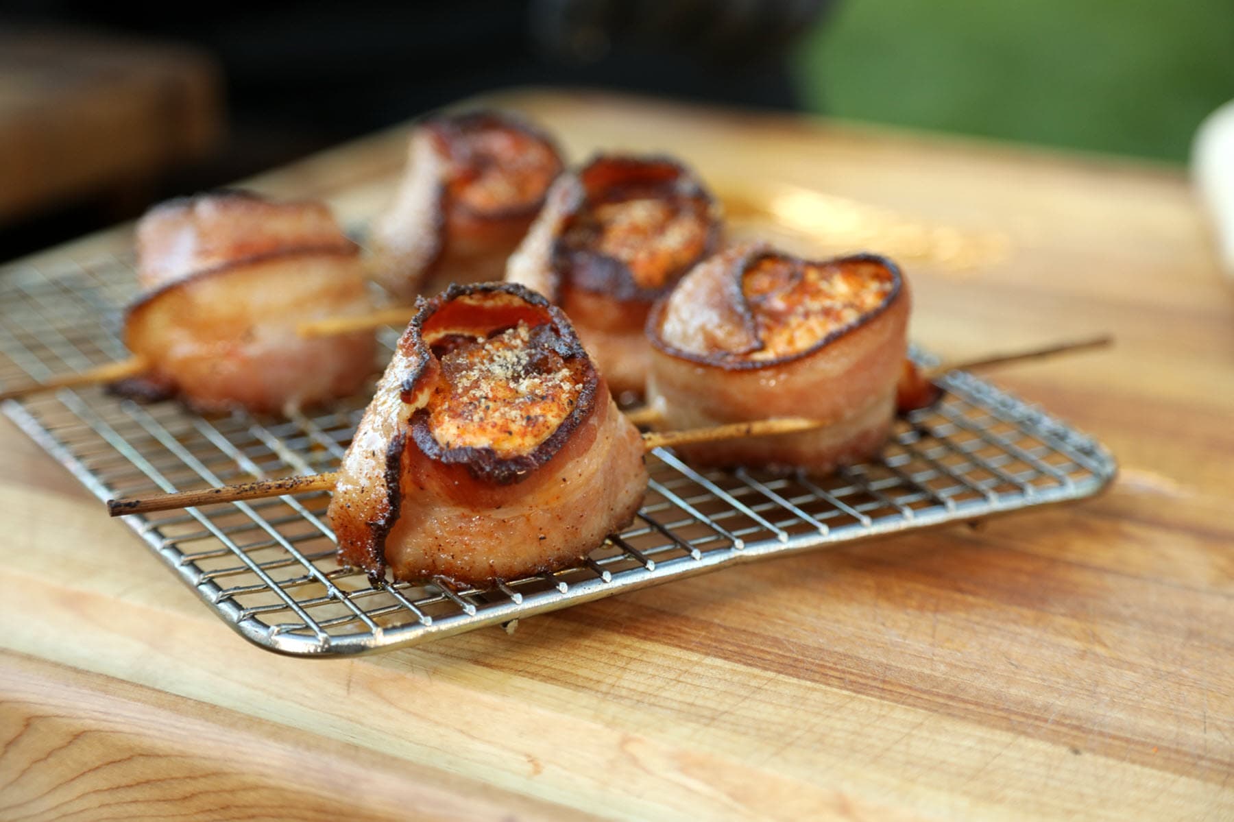 Grilled bacon and kielbasa pig shots hot off the grill