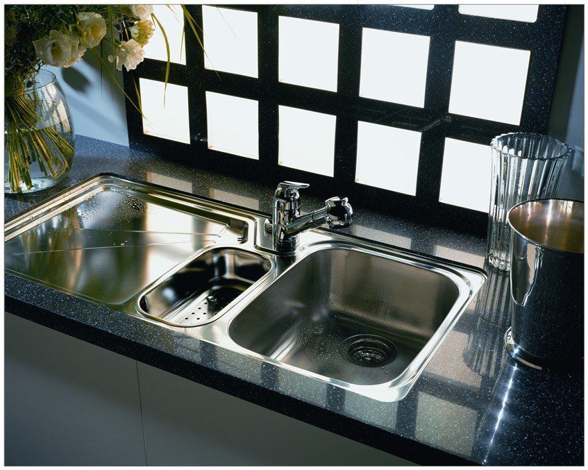 Black quartz surface installed around kitchen sink