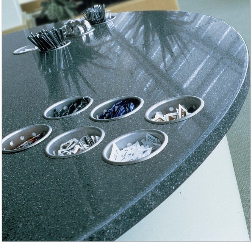 Green colour quartz surface installed with small round storage facility