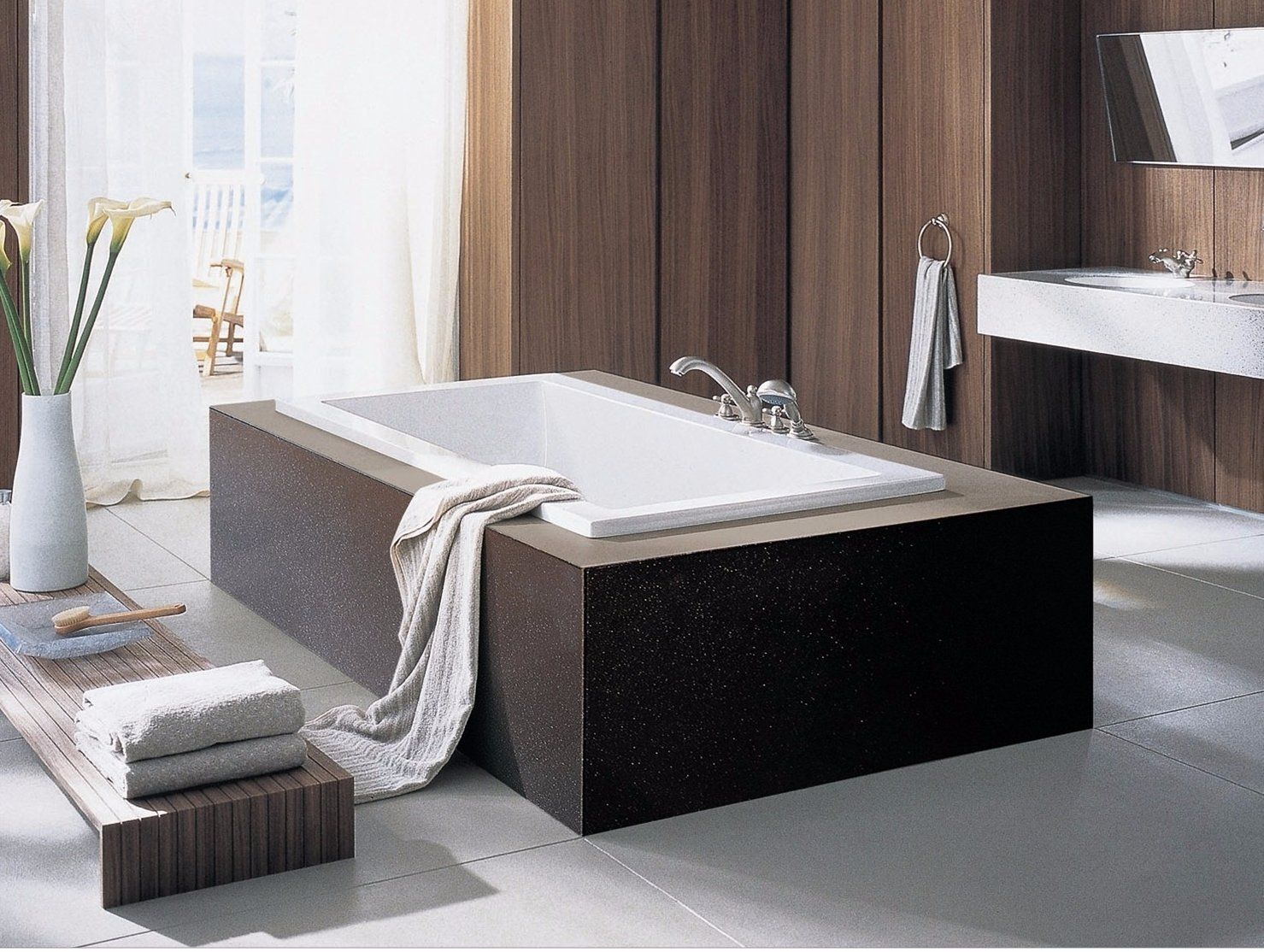 Black colour quartz surface box being made around the bath tub