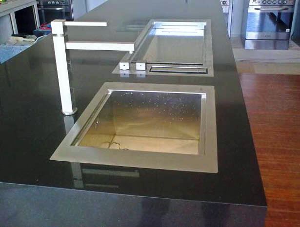 Black colour quartz surface installed in the kitchen