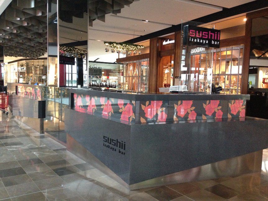 Black colour quartz surface being installed on the counter of Sushi izakaya bar