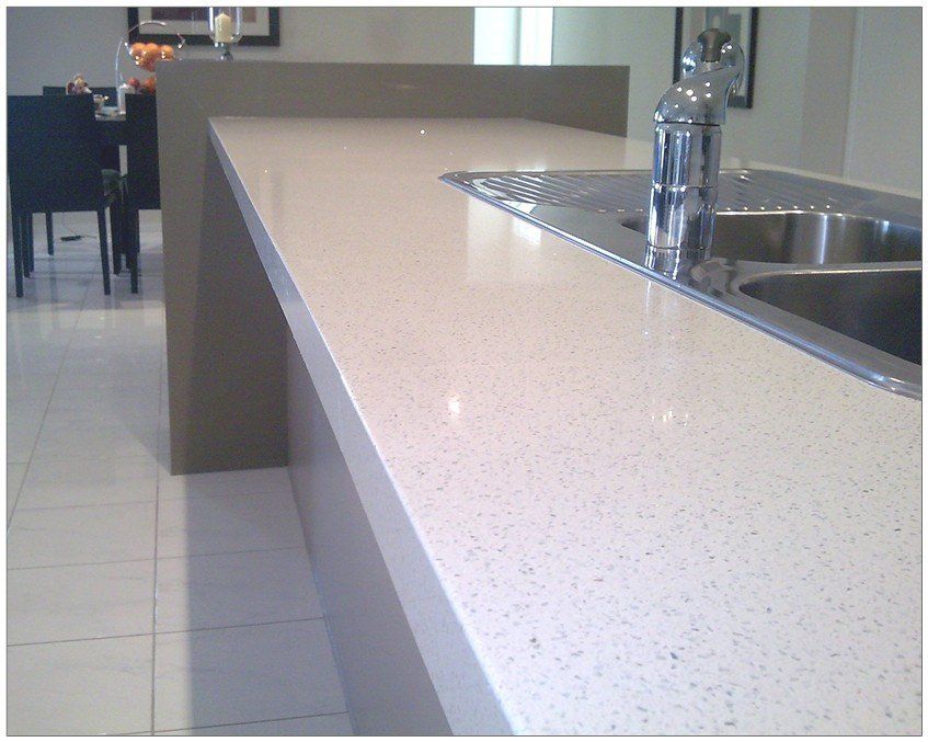White colour quartz surface installed near the kitchen sink