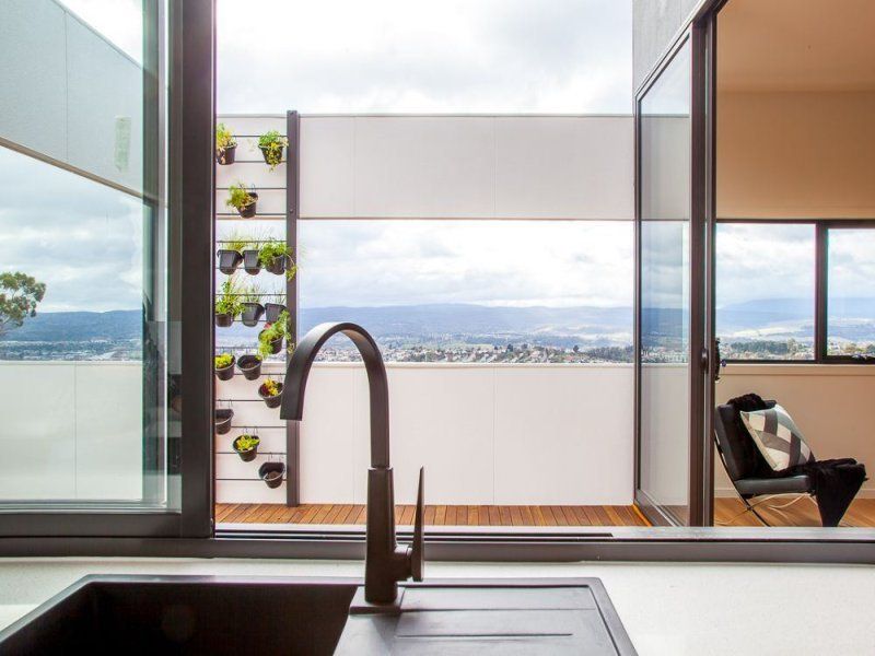 View of the kitchen counter top with toughened white quartz surface