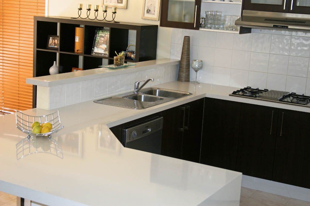 White colour quartz surface installed in the kitchen