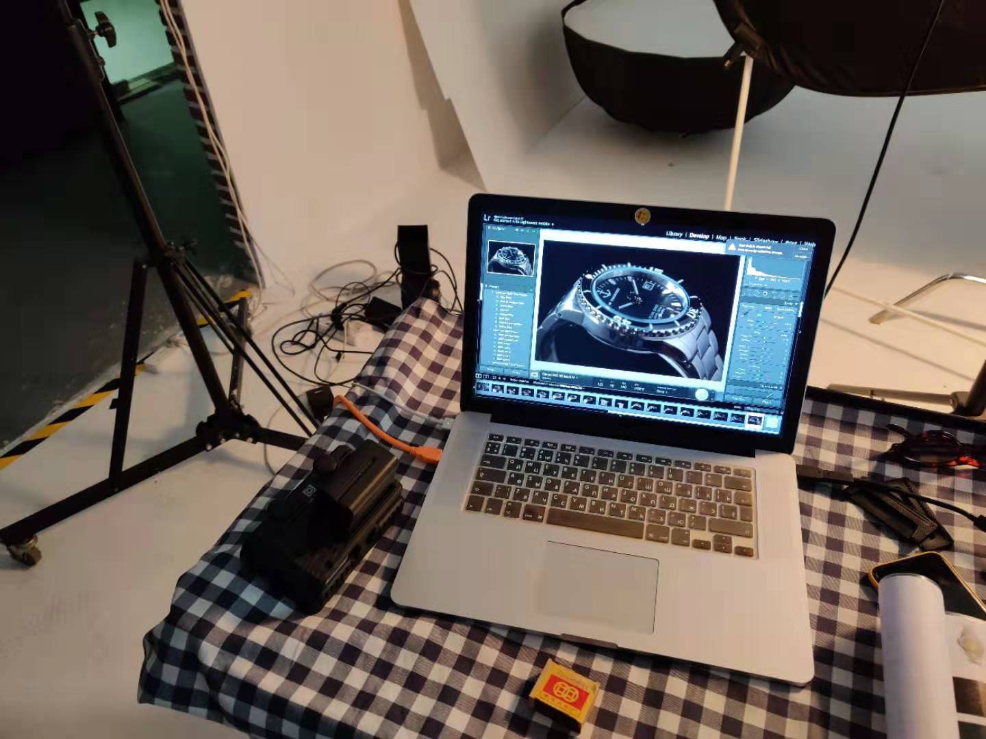 A laptop with a picture of a watch on the screen