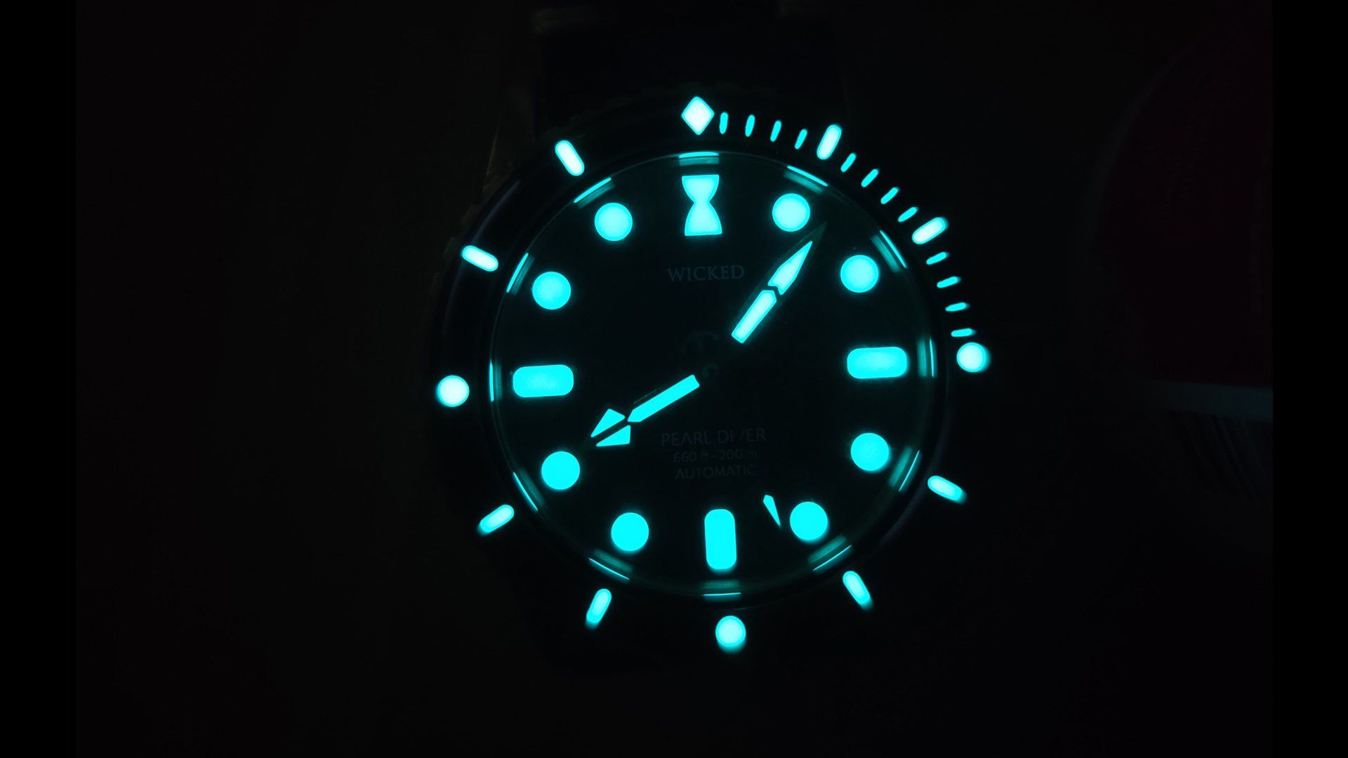 The face of a watch is glowing in the dark