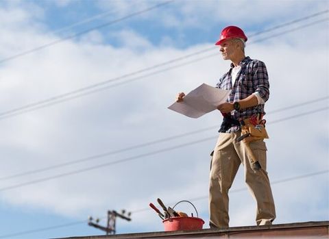 Inspecting the roof — roofing in Galt, CA Inspecting the roof — roofing in Galt, CA