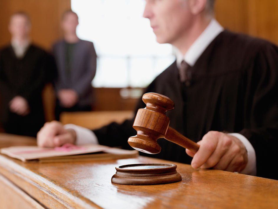 Judge Holding Gavel in Courtroom — Glen Burnie, MD — The Law Offices Of Fischer & Putzi, P.A.