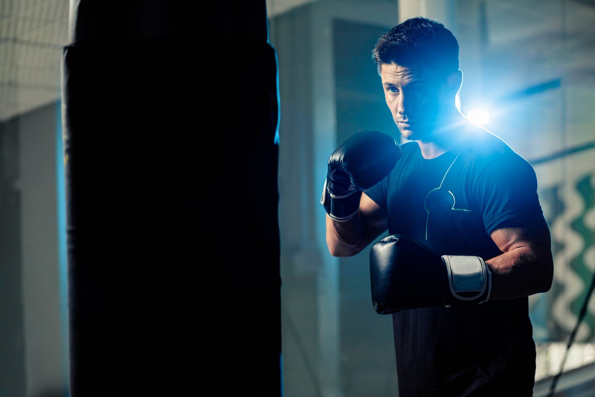 Athletic male boxer with a strong,