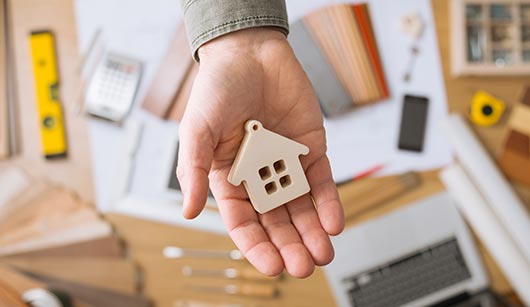 Miniature house on hand — insurance agent in Sault Ste. Marie, MI