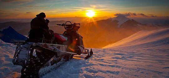 Snowmobile on a Beautiful Winter Landscape — Specialty Lines in Sault Ste. Marie, MI