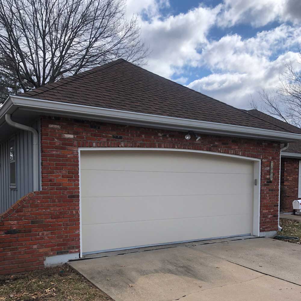 before and after picture of new flush panel garage door installation