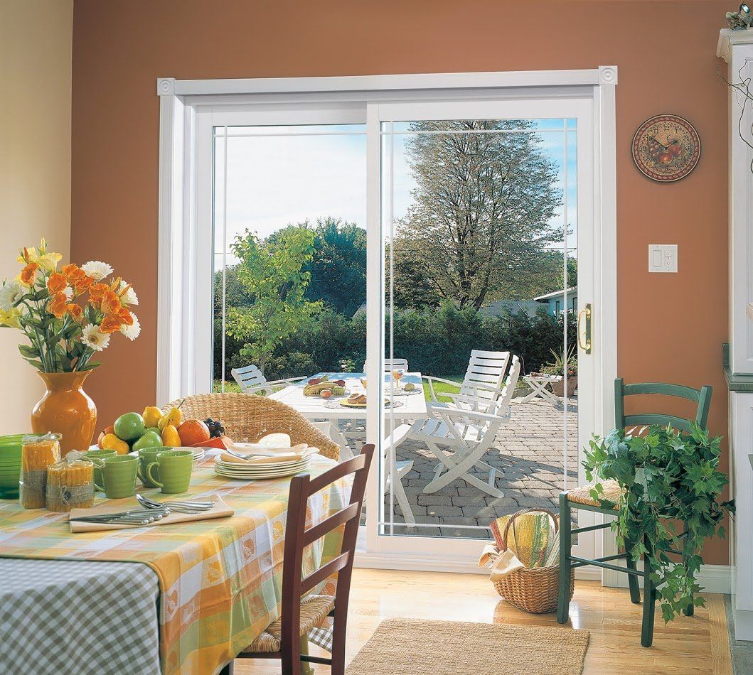 white sliding patio door in dining room area