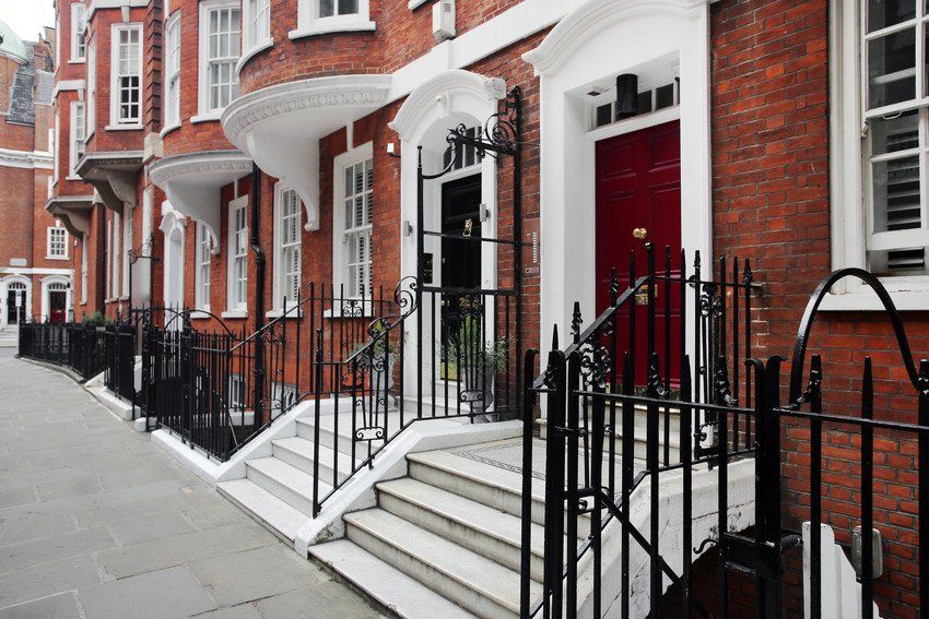 Brick row houses along Draycott Place and Cadogan Gardens near Cadogan Square in the affluent and exclusive neighborhood of Chelsea, London