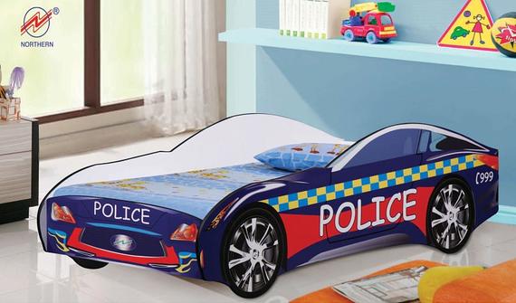 A child's bed shaped like a police car, blue with checkered accents, in a bedroom setting.