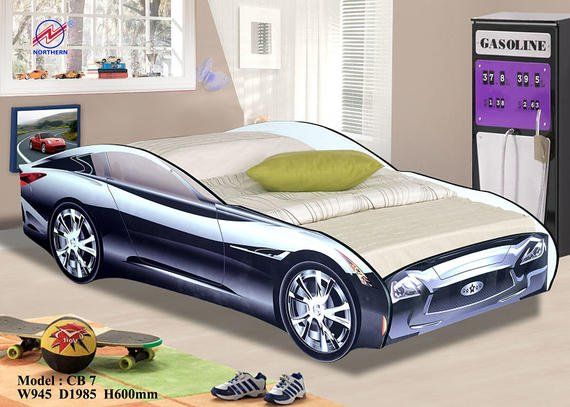 Car-shaped bed in a child's room with a gas pump and skateboards.