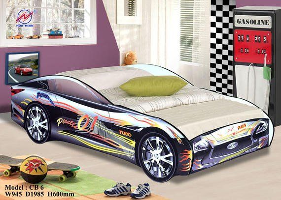 Car-shaped bed in a child's room.  Bed has flame decals and shiny wheels.  Room features a checkered cabinet and car artwork.