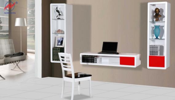 White and red wall-mounted shelves with displayed items and a laptop against a tan wall. A white chair sits nearby.
