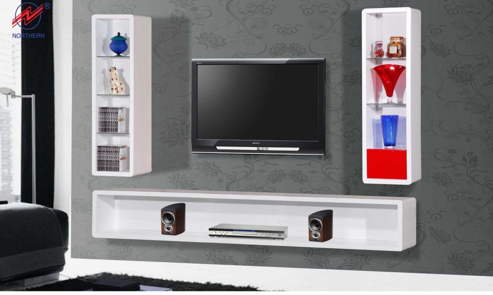 Modern white wall unit with a TV, shelves, and display cabinets on a gray wall.