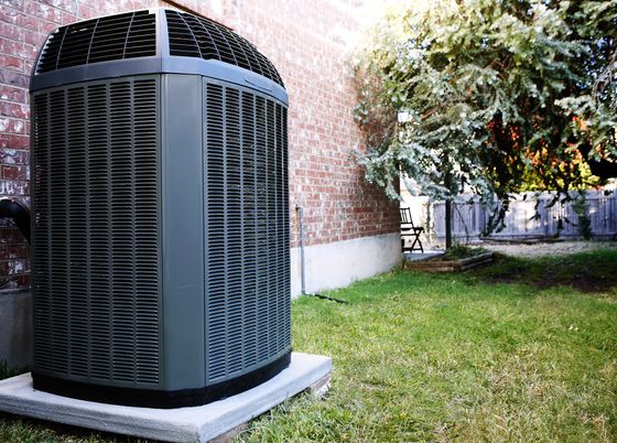 Trusted heating and cooling expert servicing an air conditioner in Baraboo, WI