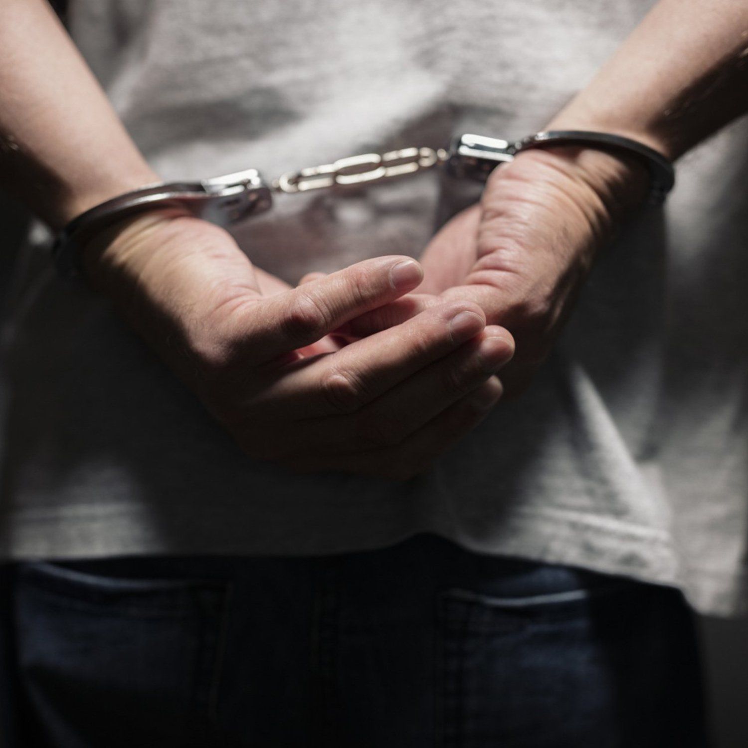 Criminal in Handcuffs — Greenville, TN — Woody Smith Attorney at Law Criminal in Handcuffs — Greenville, TN — Woody Smith Attorney at Law
