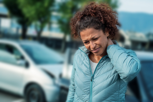Woman Holding Her Neck After a Car Accident — Whitehall, PA — Richard D. Director Law Offices Woman Holding Her Neck After a Car Accident — Whitehall, PA — Richard D. Director Law Offices