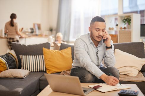 Man on the Phone Working in His Living Room — Whitehall, PA — Richard D. Director Law Offices