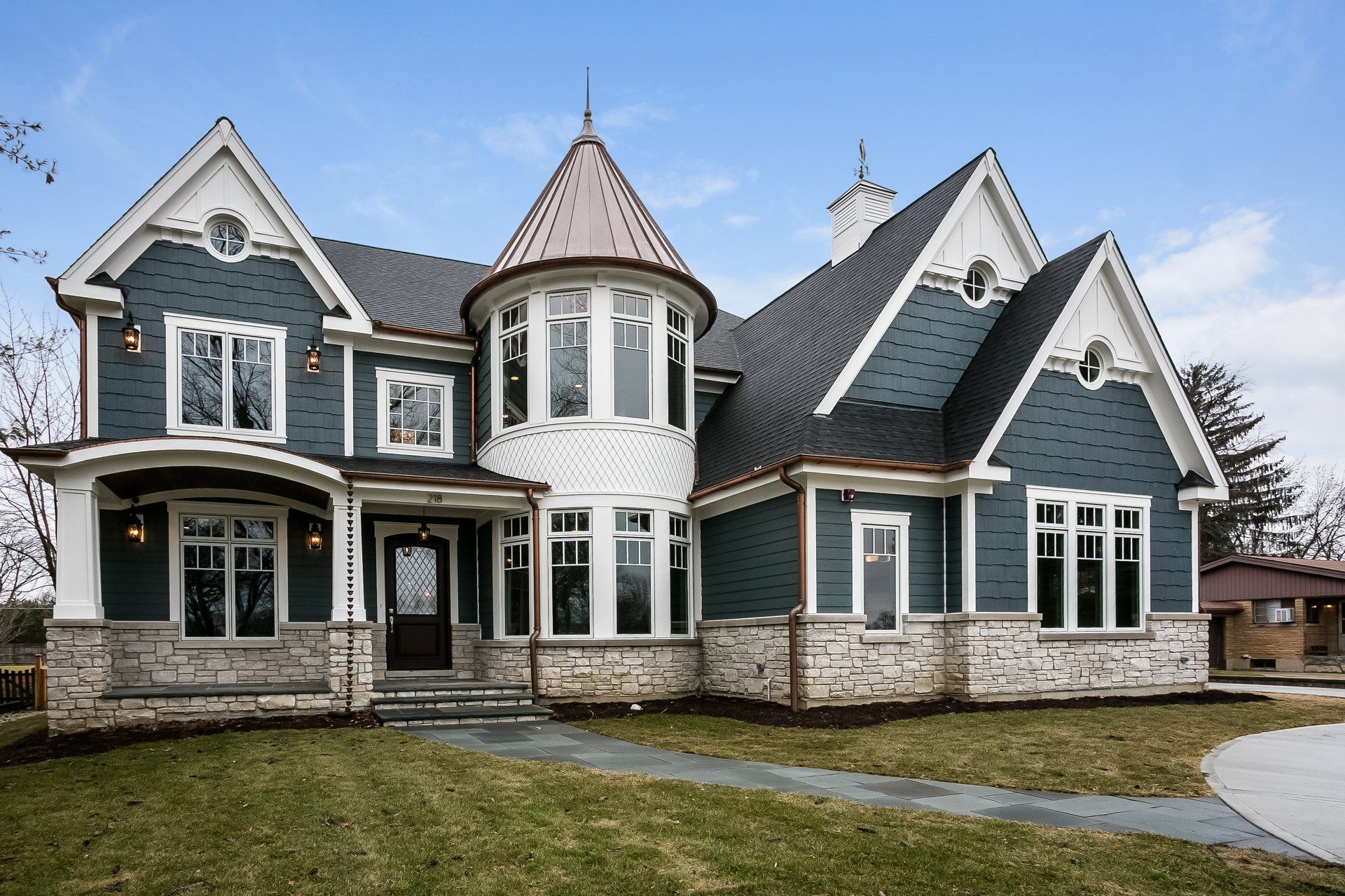 A large house with a tower on top of it