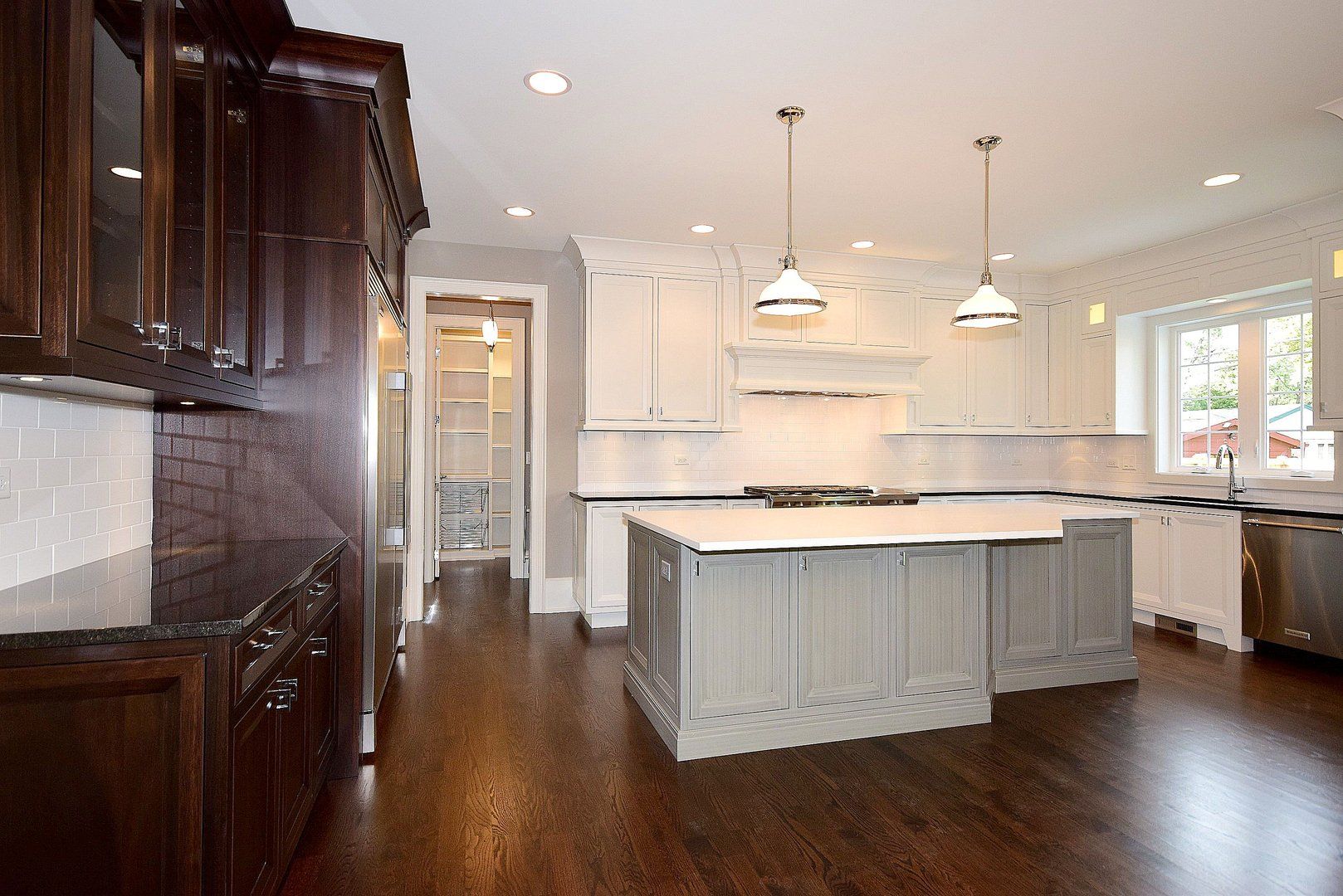 There is a large island in the middle of the kitchen.