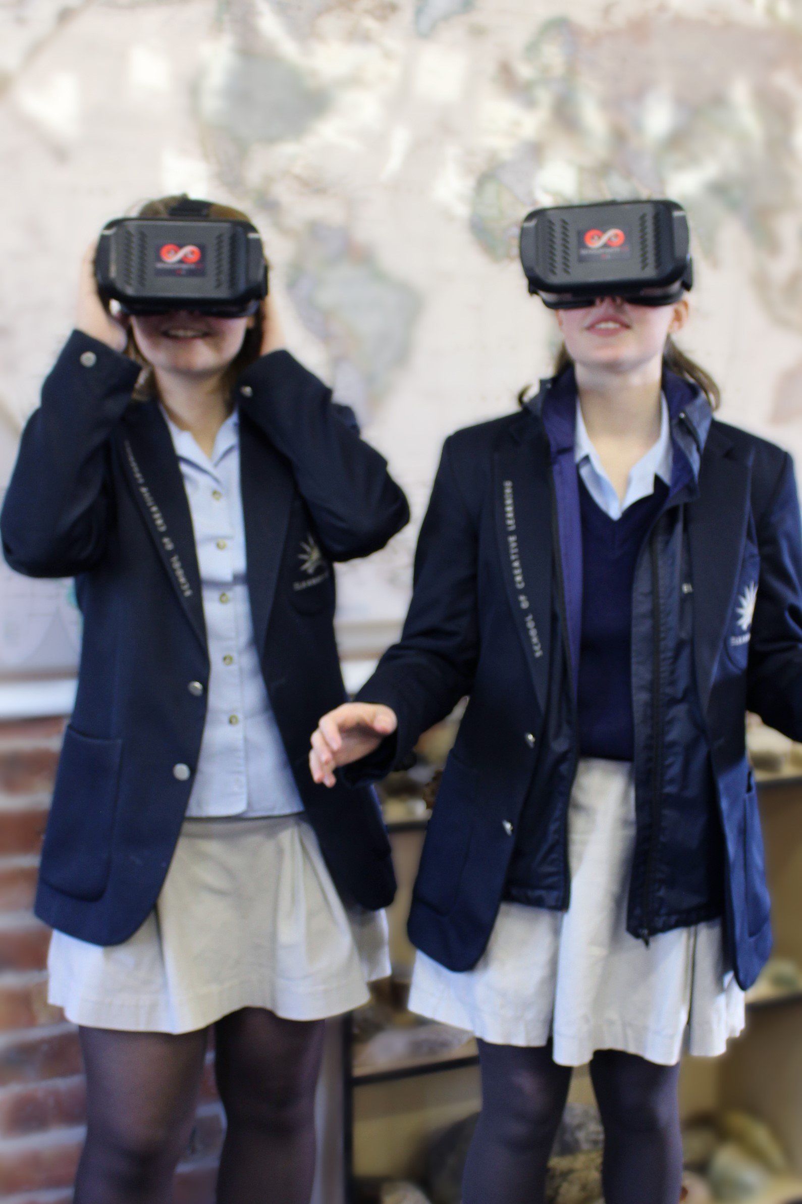 two girls wearing virtual reality glasses