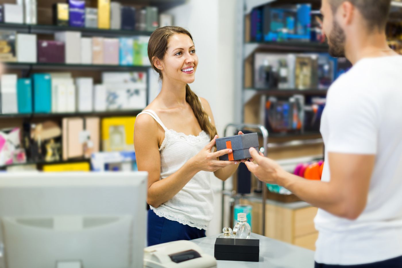 Woman paying through pos at store