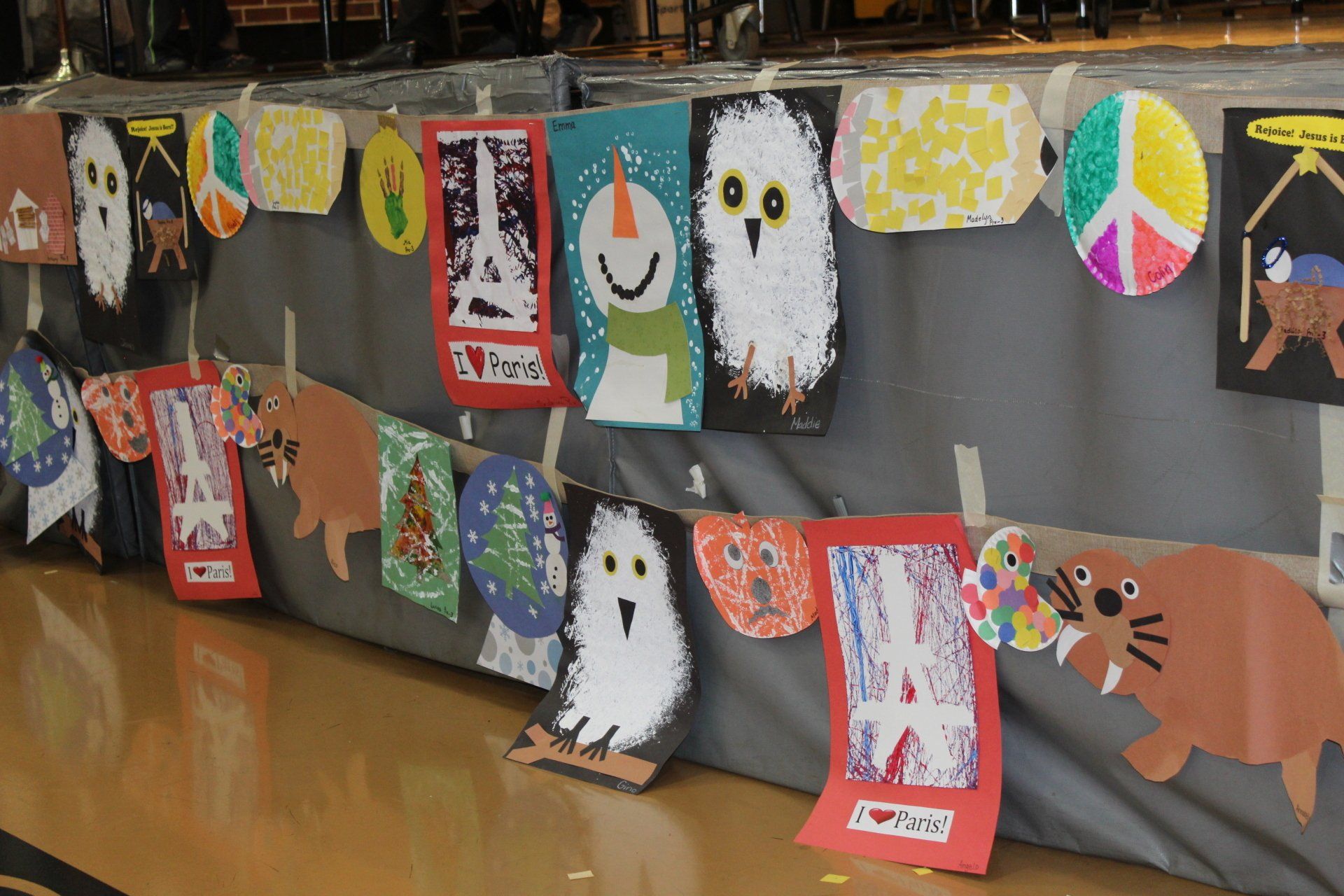 A display of children 's artwork including ghosts and bears