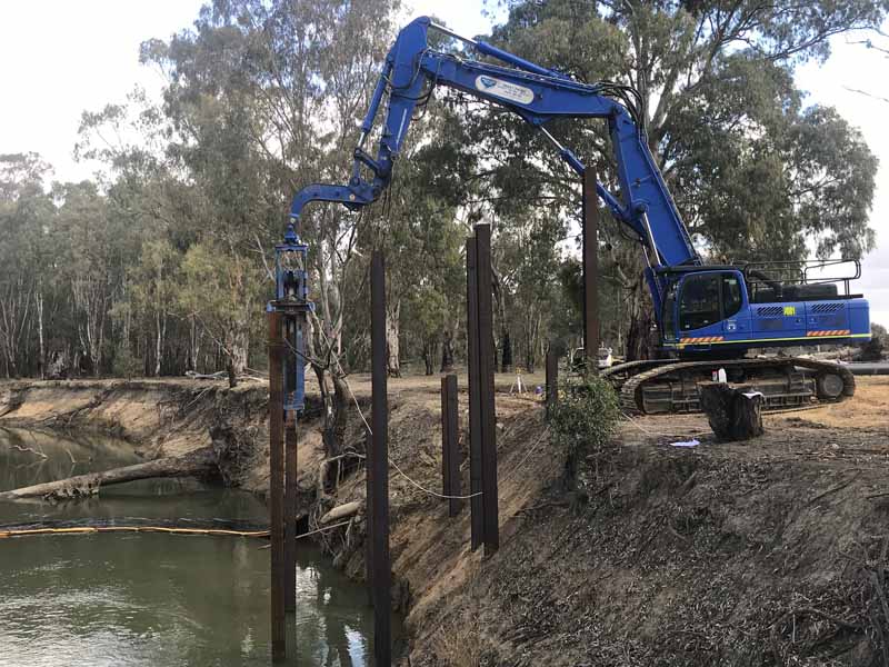 sheet piling excavator by water