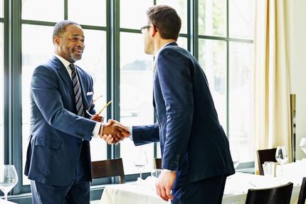 two people shaking hands