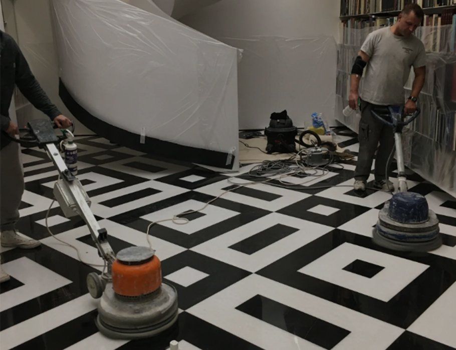 men polishing marble floor