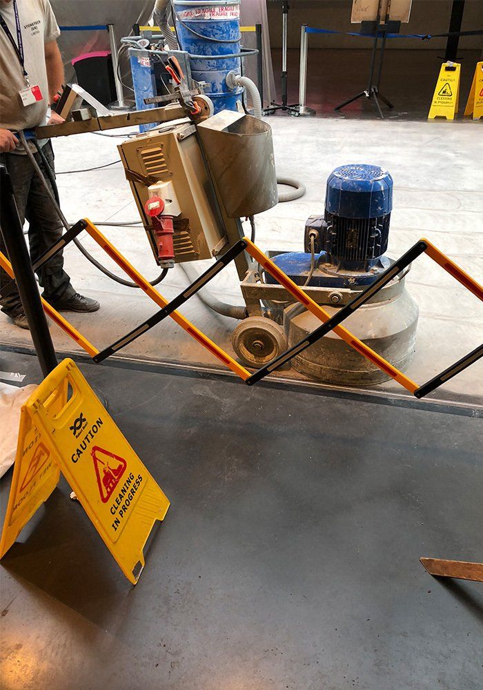 man reconditioning marble floor