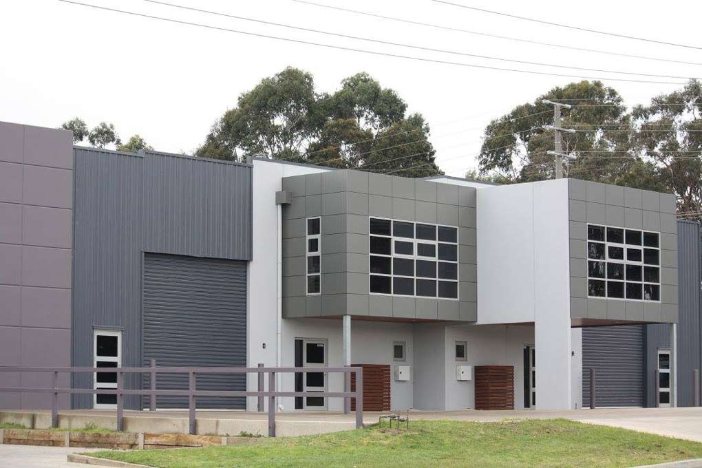 a modern looking building with many windows