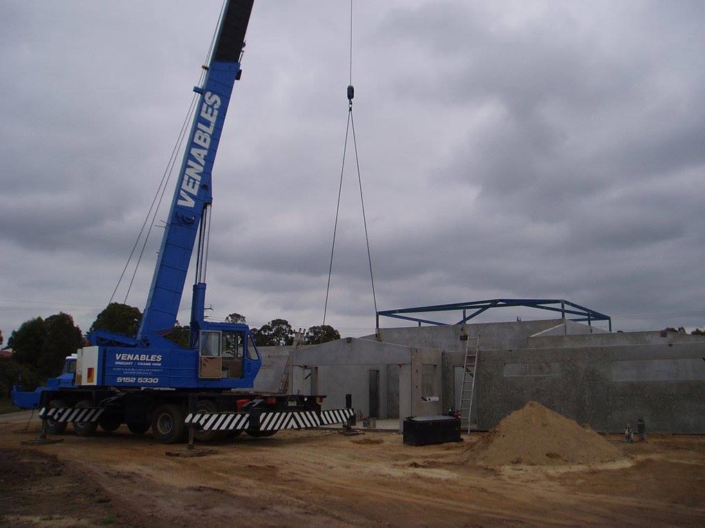 a large crane putting together a building
