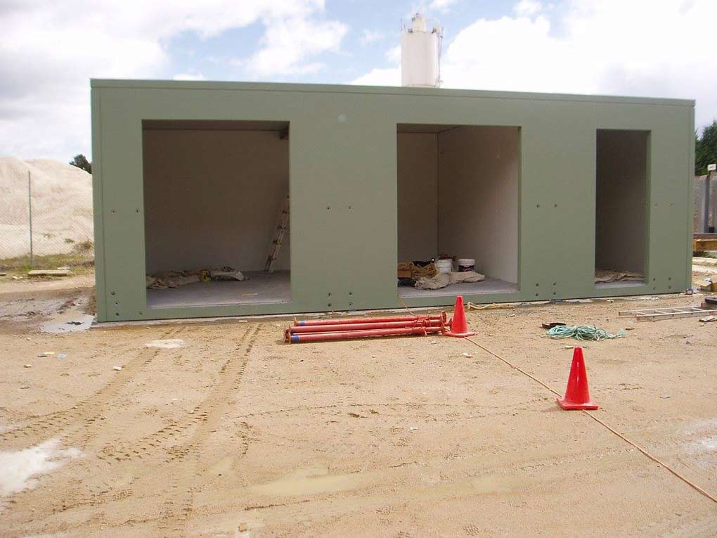 a green structure with three openings