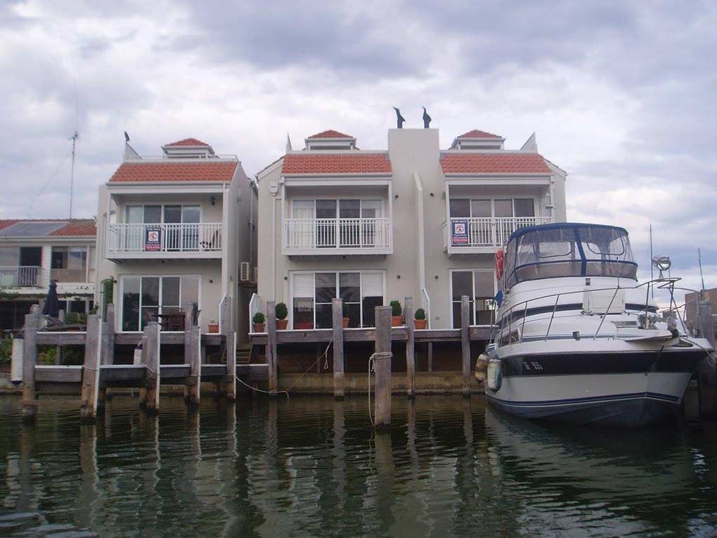 a building with a boat in front of it