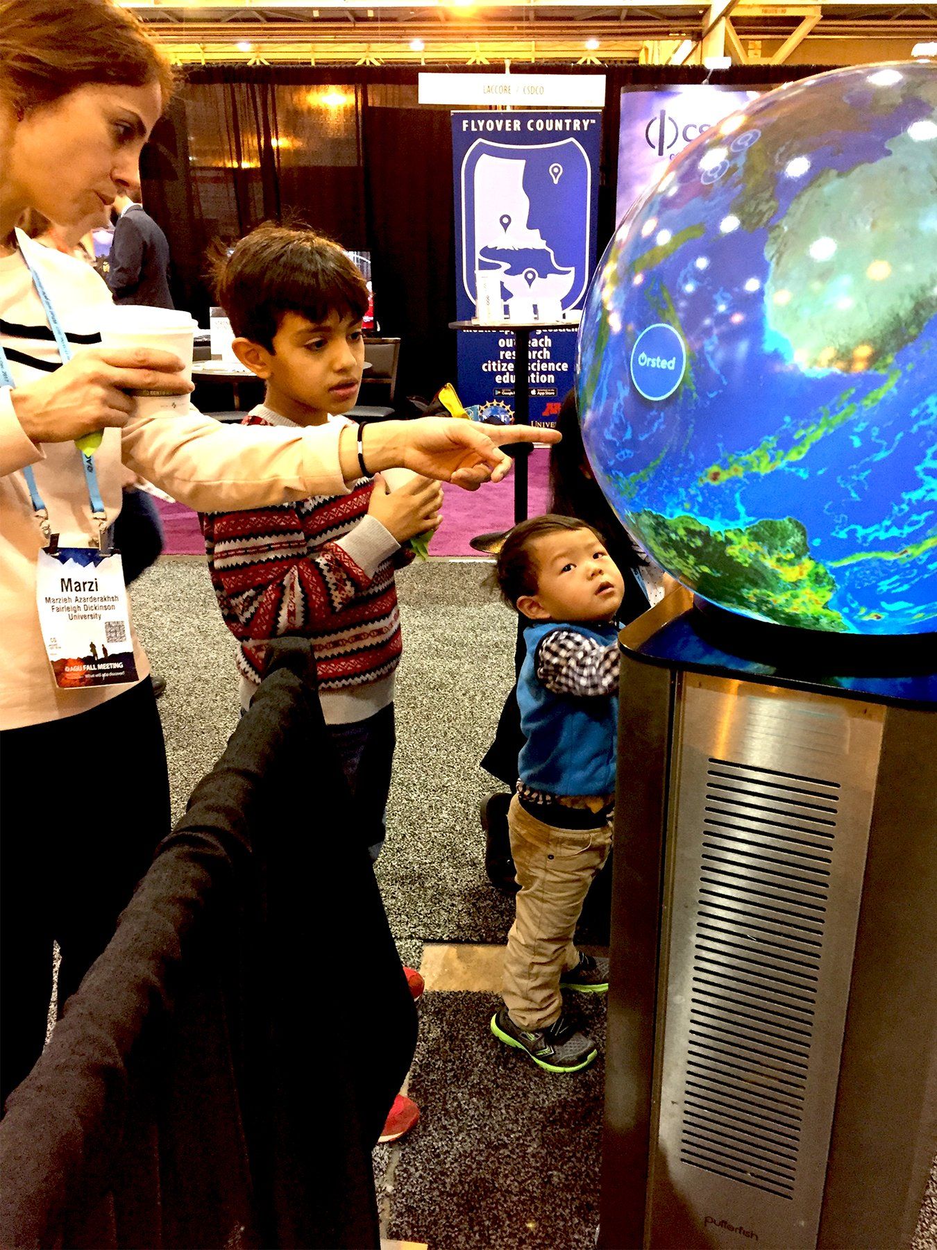 Family engaging with Pufferfish Interactive Display.